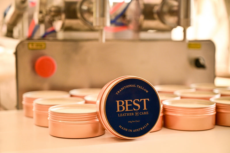 Tins of BEST Leather Care on the filling machine
